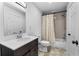 Bathroom with a single sink vanity and shower over tub at 100 Reed St, Canton, GA 30114