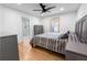 Bedroom featuring a bed, hardwood floors, a ceiling fan, and natural light at 100 Reed St, Canton, GA 30114
