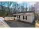 Street view of a well-maintained home with a covered porch and manicured lawn at 100 Reed St, Canton, GA 30114