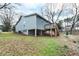 Charming home exterior features a deck, siding, and a well-maintained lawn at 100 Reed St, Canton, GA 30114