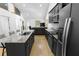 Open kitchen with granite counters, stainless appliances, and views to the living room at 100 Reed St, Canton, GA 30114