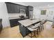 Stylish kitchen with black cabinets, granite countertops, and a center island at 100 Reed St, Canton, GA 30114