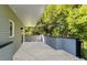 Private balcony with gray horizontal fencing and a view of the lush green trees at 1186B Francis Nw St, Atlanta, GA 30318