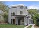 Modern home with gray siding, large windows, and a rooftop deck provides abundant natural light at 1186B Francis Nw St, Atlanta, GA 30318