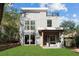 Charming modern home with a rooftop deck, stylish gray siding, and a well-manicured lawn at 1186B Francis Nw St, Atlanta, GA 30318