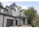 Exterior of a modern grey home showcasing a two-car garage, lush landscaping and architectural details at 1186B Francis Nw St, Atlanta, GA 30318
