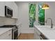 Contemporary kitchen with stainless appliances, quartz countertops and great natural light at 1186B Francis Nw St, Atlanta, GA 30318