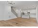 Inviting open-concept living space, staircase, and stainless steel appliances with hardwood floors at 1186B Francis Nw St, Atlanta, GA 30318