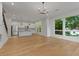 Open-concept space with stainless steel appliances, a staircase, and scenic views from the large windows at 1186B Francis Nw St, Atlanta, GA 30318