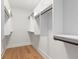 Spacious walk-in closet with custom shelving and hardwood floors, perfect for organization and storage at 1186B Francis Nw St, Atlanta, GA 30318