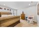 Spacious bedroom showcases a tufted headboard, sitting chair, and soft carpet at 250 Riverclub Rd, Acworth, GA 30101