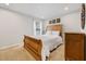 Cozy bedroom features a wood bed frame, soft carpet, and ample natural light at 250 Riverclub Rd, Acworth, GA 30101