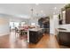 Gourmet kitchen featuring a center island, stainless steel appliances, and an adjoining dining area at 250 Riverclub Rd, Acworth, GA 30101