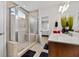 Stylish main bathroom featuring a glass-enclosed shower, double sinks, and contemporary finishes, for a spa-like experience at 250 Riverclub Rd, Acworth, GA 30101
