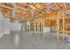Unfinished basement featuring tile flooring, exposed beams, and insulation at 4050 Preserve Crossing Ln, Cumming, GA 30040