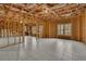 Spacious unfinished basement with tile flooring, exposed beams, and natural light at 4050 Preserve Crossing Ln, Cumming, GA 30040