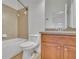 Bathroom showcasing a tub and shower, wood vanity, and neutral tile at 4050 Preserve Crossing Ln, Cumming, GA 30040