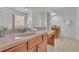 Bright bathroom with double sinks, granite countertops, wood cabinets, and a large mirror at 4050 Preserve Crossing Ln, Cumming, GA 30040