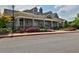 Charming clubhouse featuring stone accents, covered entrance, and colorful landscaping enhancing the community's appeal at 4050 Preserve Crossing Ln, Cumming, GA 30040