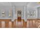 Bright foyer with hardwood floors, white walls, and natural light at 4050 Preserve Crossing Ln, Cumming, GA 30040