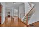 Grand foyer featuring a staircase, hardwood floors, and a welcoming entrance at 4050 Preserve Crossing Ln, Cumming, GA 30040