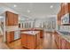 Spacious kitchen with stainless appliances, granite counters, and center island at 4050 Preserve Crossing Ln, Cumming, GA 30040