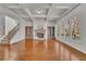 Spacious living room with stone fireplace, built-ins, and hardwood floors at 4050 Preserve Crossing Ln, Cumming, GA 30040