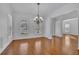 Open living room with hardwood floors and elegant trim at 4050 Preserve Crossing Ln, Cumming, GA 30040