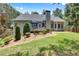 Well-maintained backyard with a deck and mature landscaping, perfect for outdoor living at 306 Blake Dr, Canton, GA 30114
