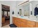 Bright bathroom with double sink vanity, large mirror, and tile floor at 306 Blake Dr, Canton, GA 30114