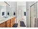 Bright bathroom featuring a double sink vanity, walk-in shower, and large soaking tub at 306 Blake Dr, Canton, GA 30114