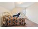 Bedroom with neutral walls, brass bed frame, and a large window with blinds at 306 Blake Dr, Canton, GA 30114