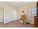 Neutral bedroom with closet, natural light, and wood dresser at 306 Blake Dr, Canton, GA 30114