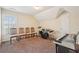 Spacious bonus room with high ceilings, natural light, and music equipment at 306 Blake Dr, Canton, GA 30114