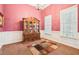Dining room featuring decorative china cabinet, chandelier, and ample natural light at 306 Blake Dr, Canton, GA 30114