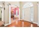 Elegant foyer with hardwood floors, a chandelier, and an arched doorway at 306 Blake Dr, Canton, GA 30114