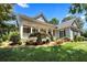 Charming home with a landscaped front yard and inviting covered porch with columns at 306 Blake Dr, Canton, GA 30114