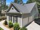 Spacious three-car garage with an upstairs and lush landscaped yard at 306 Blake Dr, Canton, GA 30114