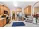 Open kitchen featuring stainless steel appliances, wood cabinets, tile backsplash, and a breakfast bar at 306 Blake Dr, Canton, GA 30114