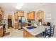Bright kitchen features wood cabinets, stainless steel appliances, a tiled backsplash, and tile floors at 306 Blake Dr, Canton, GA 30114