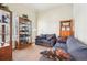 Comfortable living room featuring plush seating and a decorative display cabinet at 306 Blake Dr, Canton, GA 30114