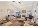 Spacious living room with a fireplace, high ceilings, and ample natural light at 306 Blake Dr, Canton, GA 30114