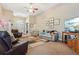 Spacious living room with a fireplace, high ceilings, and ample natural light at 306 Blake Dr, Canton, GA 30114