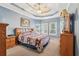 Cozy main bedroom with soft blue walls, carpeted floors, and bright natural lighting at 306 Blake Dr, Canton, GA 30114