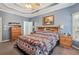 Spacious main bedroom features a tray ceiling, neutral paint, and an ensuite bathroom at 306 Blake Dr, Canton, GA 30114