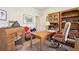 Cozy home office with built-in shelving, desk, and natural light at 306 Blake Dr, Canton, GA 30114