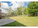 Spacious backyard with a concrete patio and wooden fence, offering ample space for outdoor activities at 920 Sublime Trl, Canton, GA 30114