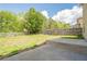 Expansive backyard featuring a concrete patio and a wood fence, perfect for outdoor entertaining at 920 Sublime Trl, Canton, GA 30114
