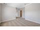 Carpeted bedroom with open doorway to hall and tall ceilings has neutral walls and trim at 920 Sublime Trl, Canton, GA 30114