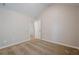A bedroom with neutral walls and carpet has an open doorway and high ceilings at 920 Sublime Trl, Canton, GA 30114